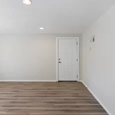 empty living room with vinyl floors